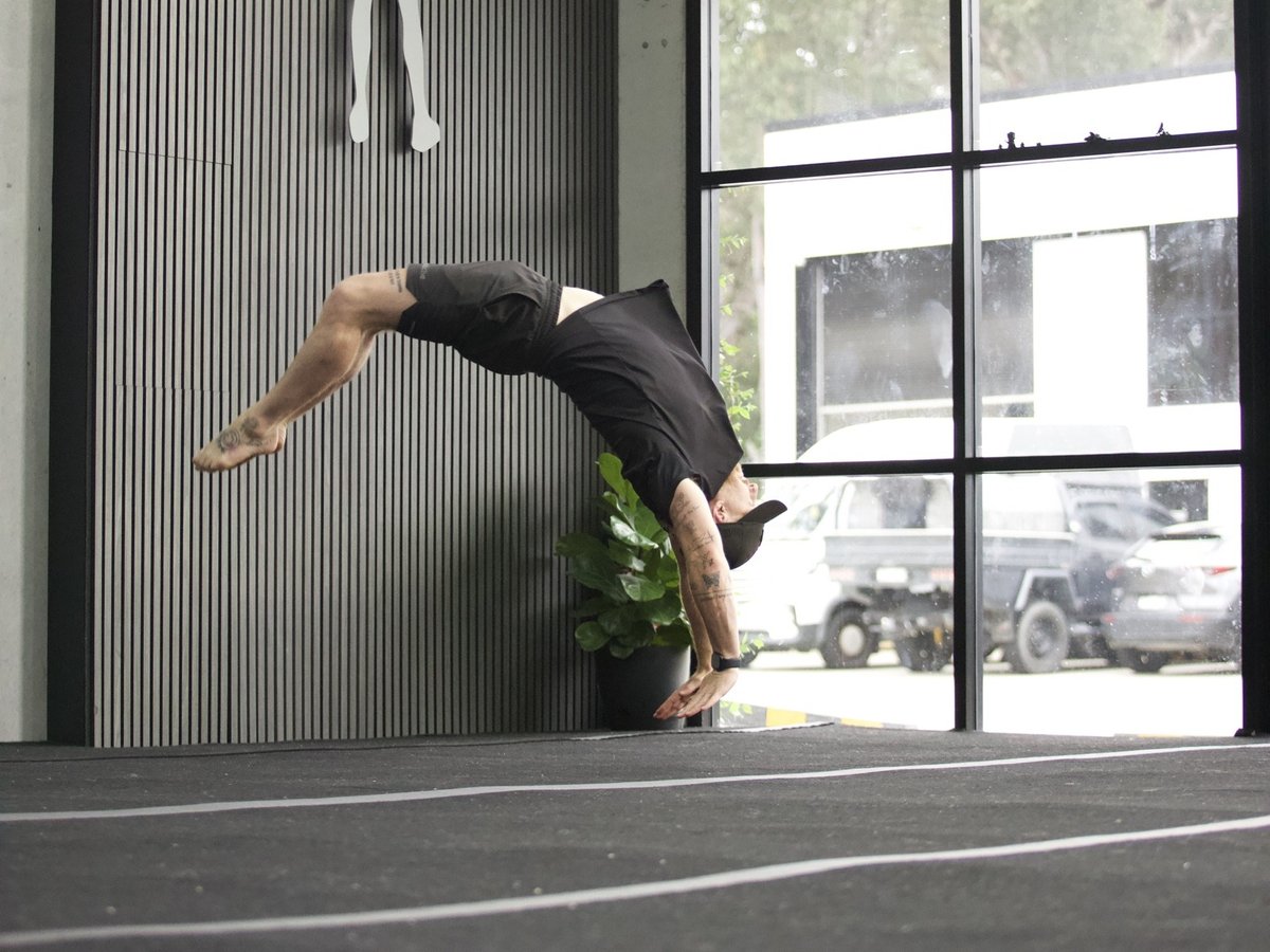 Athlete mid handspring